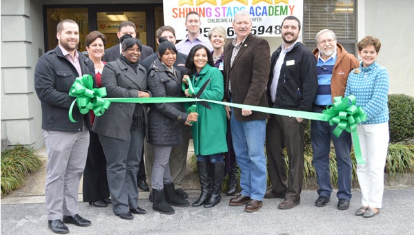 The Greater Shelby County Chamber of Commerce holds a ribbon cutting for the newly opened Shining Stars Academy. (Reporter photo/Jessa Pease)  