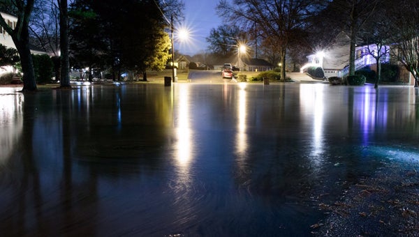 The floodwater in Cedar Cove neighborhood begins to recede late Christmas Day. (Contributed)  