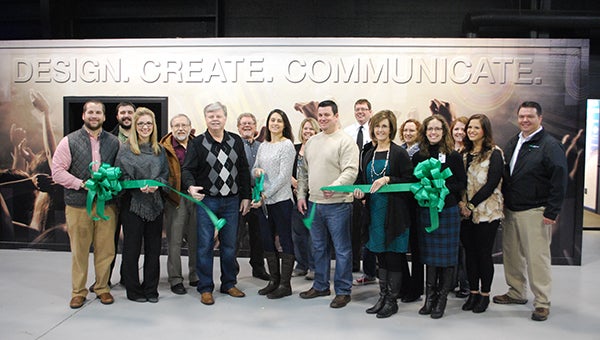 Members of the Helena community helped celebrate the grand opening of Ovation Media Inc. on Jan. 5 with a ribbon cutting ceremony. (Reporter Photo/Graham Brooks)