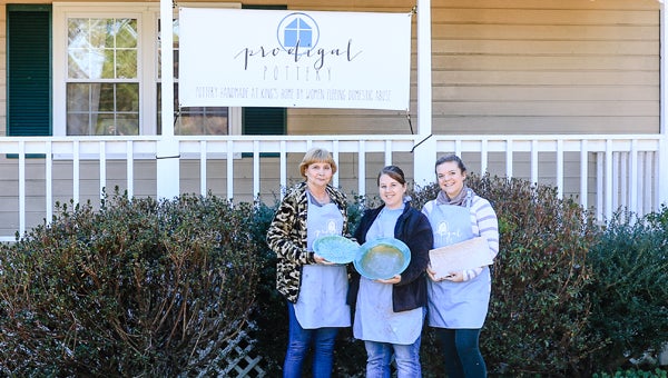 Prodigal Pottery at King's Home in Chelsea features pieces made by women who live at the home. Employees Donna Reiber, left, and Tosha Lyles, center, are pictured with director Jamie Ankenbrandt outside of the Prodigal Pottery showroom. (For the Reporter/Dawn Harrison)