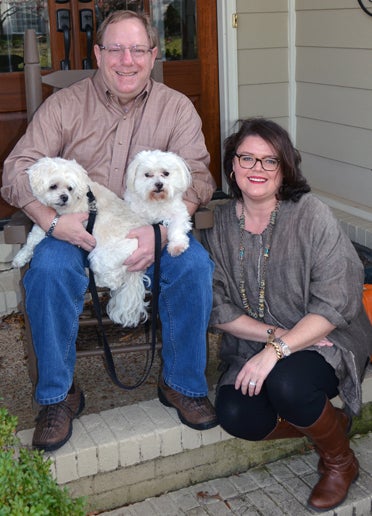 New Columbiana community columnist Jennifer Maier, right, is pictured with her family, which includes her husband, Craft Maier, and her two dogs, Max and Maddie. (Contributed)