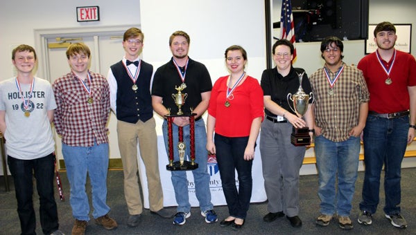 Shelby County High School Varsity Scholars Bowl Team members display their first-place trophy after beating Oak Mountain High School. (Contributed)