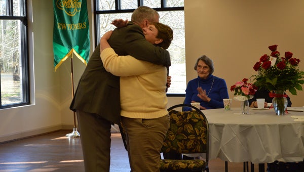 Pelham Mayor Gary Waters embraces Barbara Roberts, director the Pelham Senior Center and Pelham Public Library, at her retirement celebration Feb. 18. (Reporter photo / Jessa Pease) 