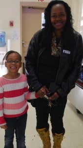 Aaliyah Whetstone and Wilma Goodlet pose in the IES cafeteria on Grandparents Day. (Reporter Photo/Molly Davidson)