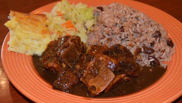 Kool Runnings serves up traditional Jamaican cuisine, such as ox tail, rice and beans, steamed cabbage and cornbread. (Reporter photo / Jessa Pease) 