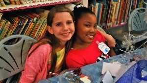 Fiona and Otisha enjoy the Harpersville Library’s tea party on Feb. 20. (Reporter Photo/Molly Davidson)