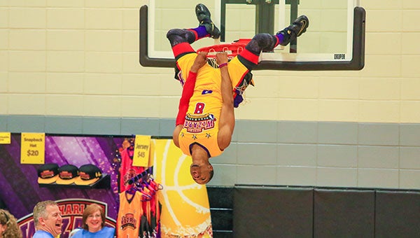 Members of the Harlem Wizards showed off their impressive slam-dunk skills when they visited Helena High School on Monday, Feb. 22, to benefit the HHS Band Boosters. (For the Reporter/Dawn Harrison)