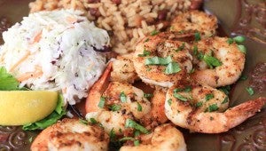Pair grilled shrimp with sides like coleslaw and red beans and rice. 