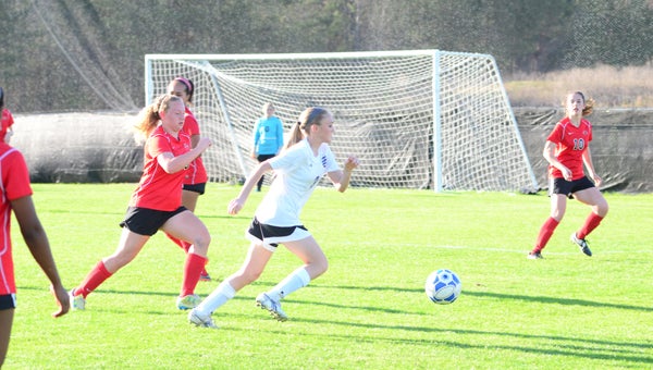Chelsea's Lexie Duca attempts to get past Thompson's Peyton Poe during the Lady Hornets' 2-1 win on March 15. (Reporter Photo / Baker Ellis)