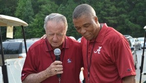 Jeremiah Castille prays with former Florida State University head football coach Bobby Bowdon. (Contributed)