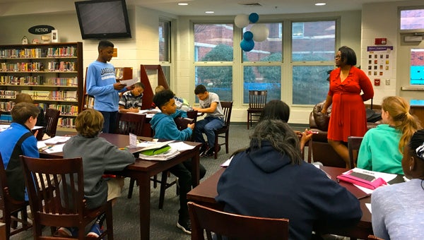 A seventh grade student shares a character he developed with this peers and author Chandra Sparks Splond during a March 3 workshop. (Reporter Photo/Molly Davidson)