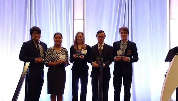 From left, Angel Rivera, Jessie Zou, Toni Massey, Andrew Black, and Schuyler Arn pose with awards they received at the Alabama State DECA Career Development Conference. (Contributed)