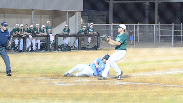 Helena’s Sam Praytor (14) slides in safely to score a run in game two of a doubleheader against the Pelham Panthers on Tuesday, March 8. (Reporter Photo/Graham Brooks)