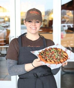Kimberly Johnson enjoys sharing pizzas with new and loyal customers. 