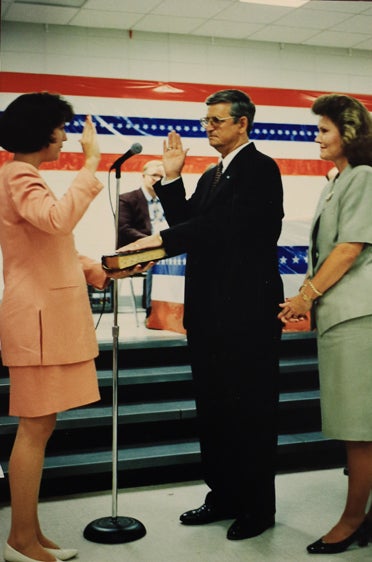 Earl Niven, second from left, takes his oath of office in 1996. He is pictured with then Shelby County Probate Judge Patricia Fuhrmeister and his wife, June Niven. (For the Reporter/Dawn Harrison)