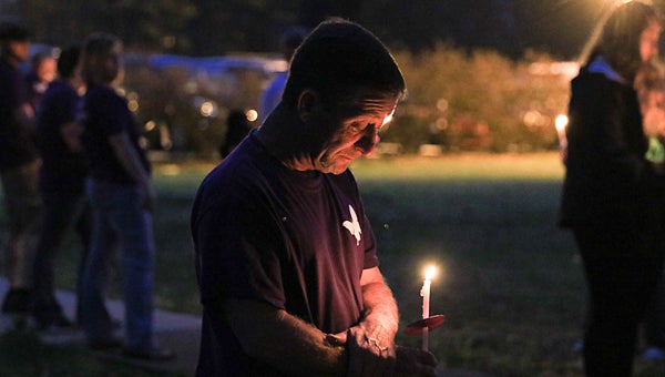 Jolee Callan’s father, Michael, participates in a candlelight vigil in memory of his slain daughter on March 12 at Vincent Municipal Park. (For the Reporter/Dawn Harrison)