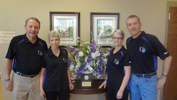 Gordon and Nancy Fluker and Lynne and Lee Morton are captains of the Wilsonville Baptist Church Relay for Life team. The couples are pictured with the team's plaque for first place top fundraising in 2015. (Reporter Photo/Emily Sparacino)