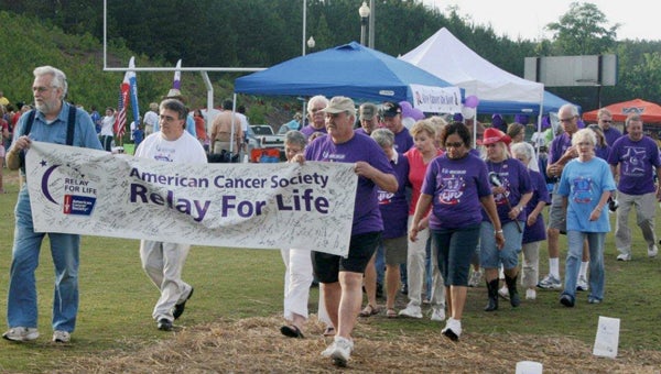 Survivors walk the first lap at the American Cancer Society's Relay for Life in Columbiana. (Contributed)