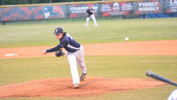 Sam Strickland delivers a pitch against Homewood on April 14. The Lions dropped the game to Homewood, forcing a third game between the two to determine who will win 6A Area 9. (Reporter Photo / Baker Ellis)