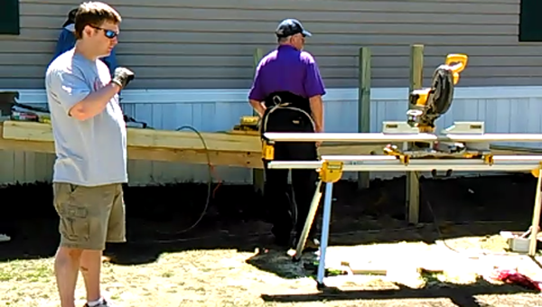 Volunteers work to build Carrie Haynes and her mother, Mary Lee Kirkland, a ramp at their home. (Contributed)