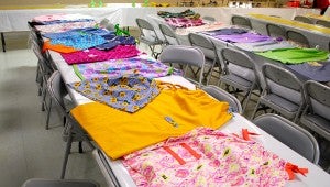 Members of the Mt. Olive Missionary Baptist Church have sewed more than 100 dresses and pants for children in Africa. (Reporter Photo/Molly Davidson)