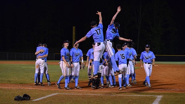 The Helena Huskies baseball team celebrates after sweeping the Sylacauga Aggies in the first round of the playoffs on Friday, April 22. (Contributed)