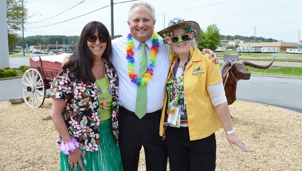 Gwen Tatum, Senior Director of Development at UAB’s Comprehensive Cancer Center Chris Thomason and Magic City Parrot Head club president Kay Moore celebrate at a Margarita Grill fundraiser. (Reporter photo/Jessa Pease) 