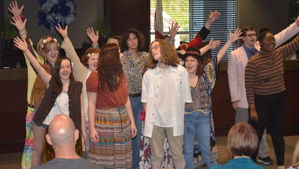 Chelsea High School Theatre students perform an excerpt from their upcoming performances of the musical "Godspell" at a Chelsea City Council meeting April 5. (Reporter Photo/Emily Sparacino)