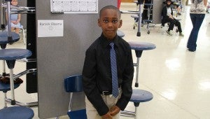 Jayden Simmons portrays President Barack Obama during the IES Living Wax Museum presentation. (Reporter Photo/Molly Davidson) 