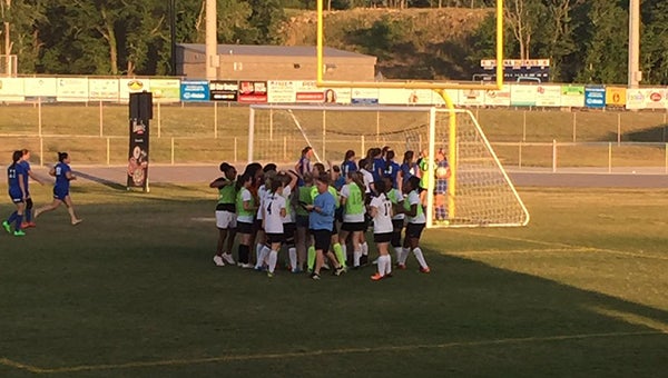 The Helena Lady Huskies soccer team celebrates after defeating Marbury 2-1 in double overtime in the third round of the playoffs on May 7. (Contributed)