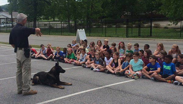 Helena police officer Phillip Richards and his K-9 partner Bak showed HES second graders what they do on a daily basis. (Contributed)
