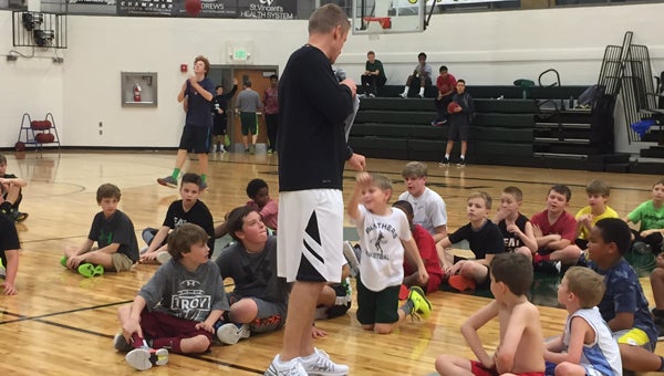 Pelham High School basketball coach Joel Floyd teaches second through sixth grade boys the basic skills and techniques of basketball. (Contributed)  