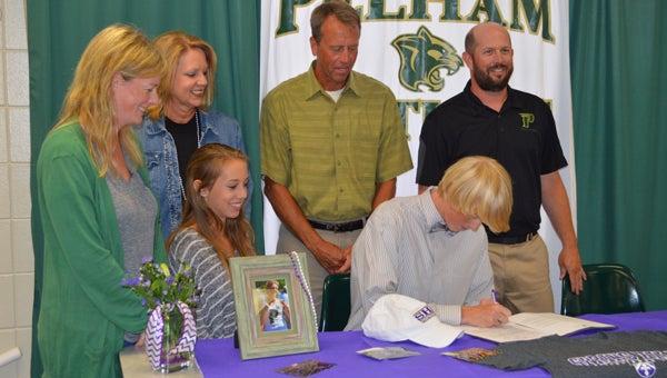 Surrounded by his coaches and family, Robbie Letson commits to run for Spring Hill College. (Reporter photo/Jessa Pease)  