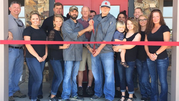 Red Zone Bar and Grill owners, Jamie Storey and Todd Bowen, celebrate their grand opening off U.S. 31 in Calera. (Contributed) 