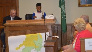 Corey Perkins, who served as mayor for the day, reads a proclamation at the mock City Council meeting. 
