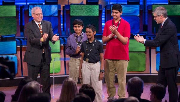 Standing with National Geographic Society President and CEO Gary E. Knell and National Geographic Bee moderator, journalist and humorist, Mo Rocca, are the top three winners of this year’s competition, Rishi Nair of Florida (center) took first place, winning a $50,000 college scholarship, a lifetime membership to the National Geographic Society and an all expenses paid, on a Lindblad Expeditions-National Geographic eight-day adventure to Southeast Alaska aboard the National Geographic Sea Lion; Kapil Nathan of Alabama (left)finished third and won a $10,000 college scholarship; and Saketh Jonnalagadda of Massachusetts (right)clinched second place and a $25,000 scholarship. (Photo by Mark Thiessen/National Geographic)