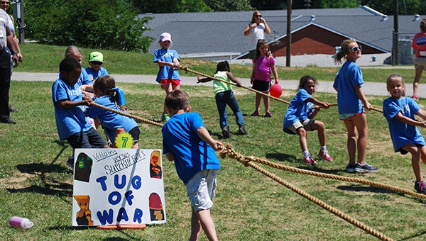 Helena Elementary School students face-off in the villains v. superheroes tug-of-war at H-Day on Monday, May 23. (Reporter Photo/Graham Brooks)
