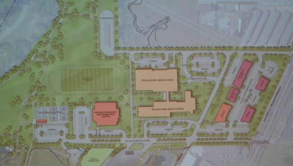 City Council President Rick Hayes presented a new conceptual layout of the city center, including the recreation center, the middle school, the library and more. (Reporter photo/Jessa Pease)