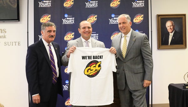 From left, University of Montevallo President Dr. John Stewart II, Gulf South Conference Commissioner Matt Wilson and Montevallo Athletic Director Mark Richard smile during a June 16 press conference announcing Montevallo’s return to the Gulf South Conference. (For the Reporter / Dawn Harrison)