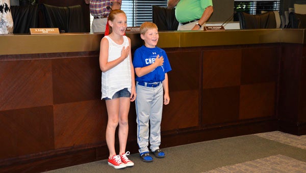 Avery and Drew Harris lead the Pledge of Allegiance at the Chelsea City Council meeting June 7. (Reporter Photo/Emily Sparacino)
