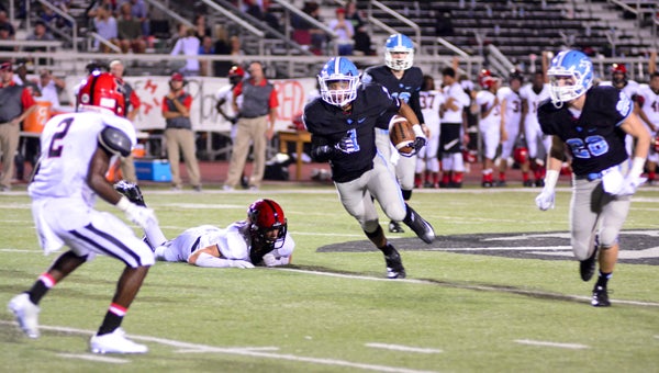 Spain Park's D'arie Johnson looks for running room during a 35-18 win over Muscle Shoals on Aug. 26.