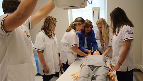 Jefferson State radiologic technology department Clinical Coordinator Annette Ferguson teaches students Anna Beth Hyde, Alana Brown, Morgan Lafoy, Aubrie Jackson and Chase Walker about an X-ray machine. (Photos by Stephen Dawkins)