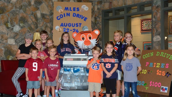 A mix of all grades at Mt Laurel Elementary School dawn their favorite colleges gear, including one girl named Brook who decided to dress up as Aubie, for the second annual coin drive put on by the MLES PTO. (Reporter photo/Alec Etheredge)
