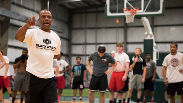 Two-time Olympian Willie Smith leads a training session for high school athletes at BlackWatch Sports Performance on July 13. Smith is director of athletic performance at BlackWatch, which opened on U.S. 280 earlier this summer. (Reporter Photo/Keith McCoy)