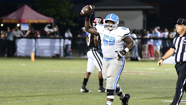 Spain Park's Burrell Boswell comes up with a fumble recovery in a 21-17 win at Gadsden City that included several big defensive plays. (Photos by Stephen Dawkins)