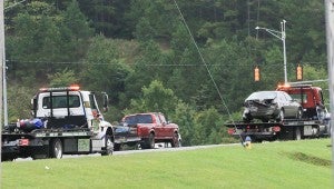 A motorcycle and a sedan involved in an early morning Aug. 20 wreck on U.S. 280 are transported from the wreck scene. (Special to the Reporter / Dawn Harrison)