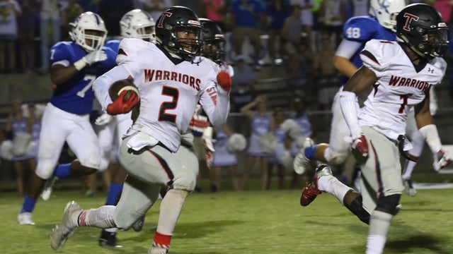 Corey Burroughs looks for room downfield to run during Thompson’s tight 10-3 win over Tuscaloosa County on Sept. 2. (For the Reporter / Eric Starling)
