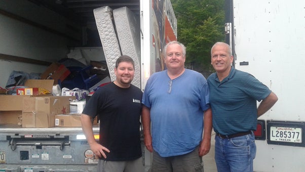 Steven Lanclos, left, drove a truck full of donations from St. John’s Anglican Church in Chelsea down to Baton Rouge, La. to help flood victims. Lanclos is the Deacon at the Chelsea church and decided to raise items to donate to St. Paul’s Reformed Episcopal Church in Baton Rouge. (Contributed)