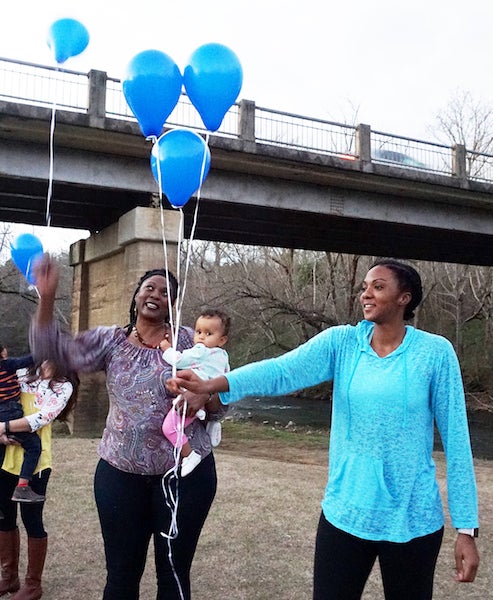 Whitney Billings, right, shares a celebratory moment at the recent balloon release honoring her mother, Demetria Billings. (Contributed)