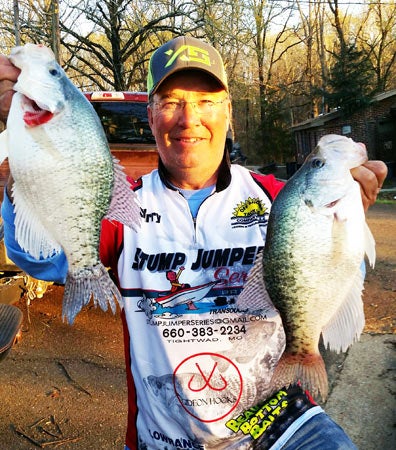 Barry Morrow, also known as the "crappie coach" for Jefferson State Crappie University, holds a couple of his catches. 